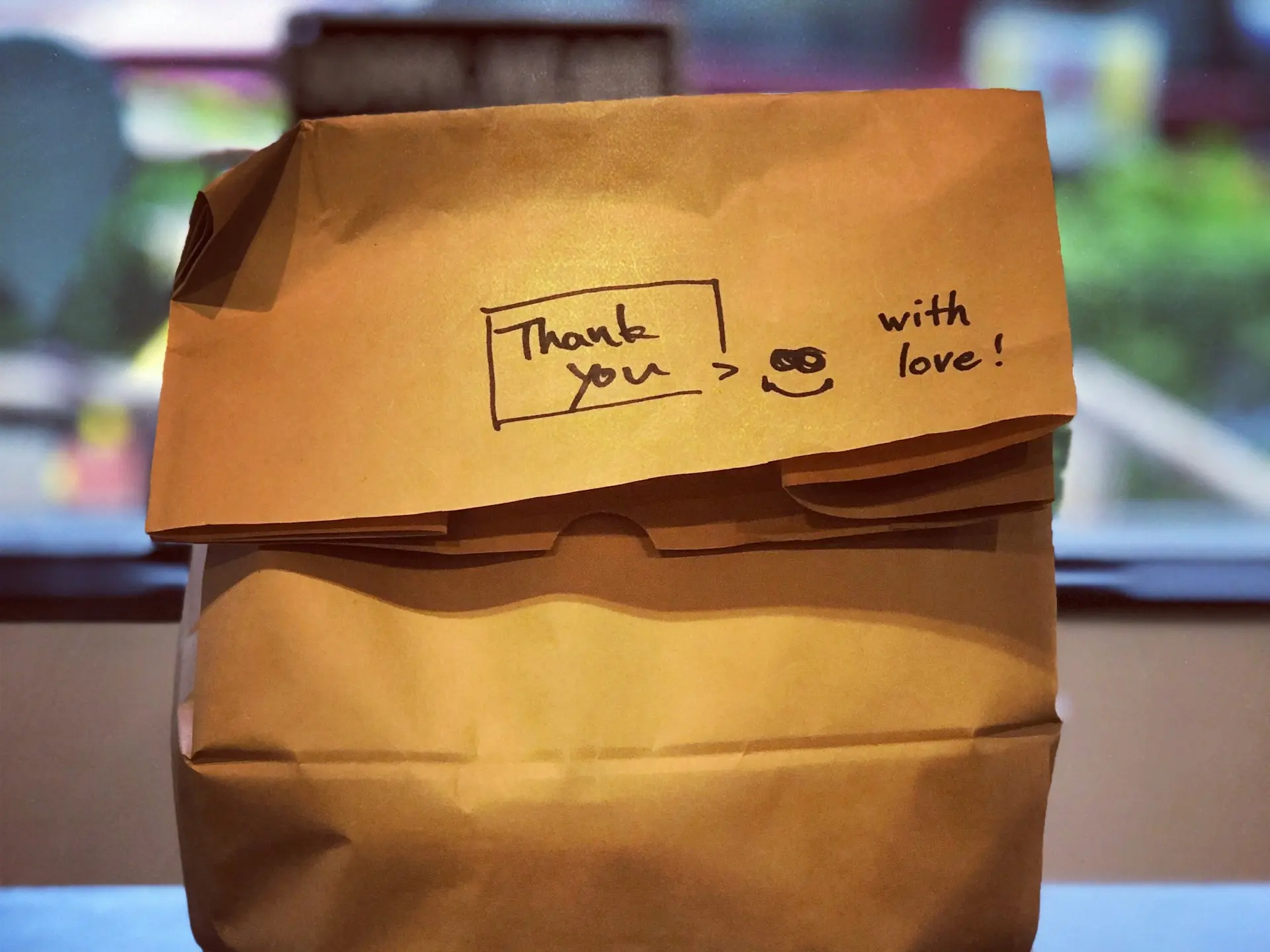 brown paper bag on brown wooden table